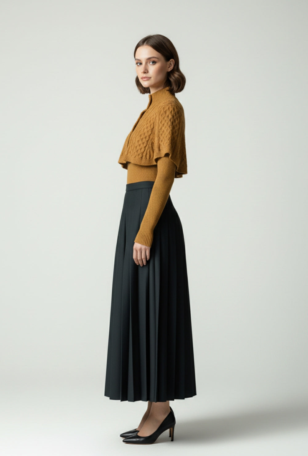 Sweter z golfem i krótką narzutką o splocie warkoczowym